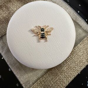 Elegant White Round Mirror with Gold Bee Accent